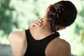 The girl is worried about the symptoms of cervical osteochondosis
